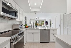 Fridge, microwave, oven, stovetop - C-117 - Luxury Park Shore Resort Condo with Pool (Naples)