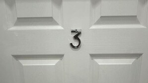 A white door with a metal number '3' sign. - London zone 2 Private room (Greater London)