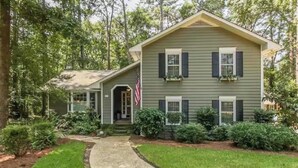A two-story house with a front porch, a small attached garage, and a well-maintained lawn. - Masters Rental 3.5 miles from the Augusta National (Martinez)