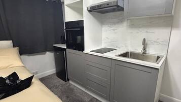 Fridge, microwave, cookware/dishes/utensils