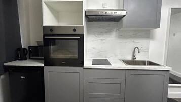 Fridge, microwave, cookware/dishes/utensils