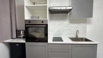 Fridge, microwave, cookware/dishes/utensils
