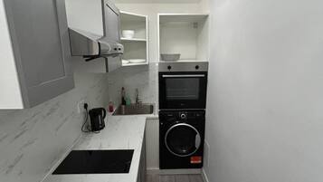 Fridge, microwave, cookware/dishes/utensils