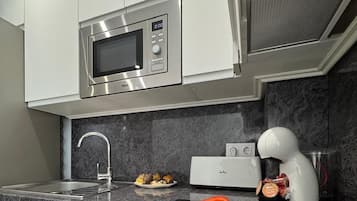 Comfort Apartment, Patio | Private kitchen | Coffee/tea maker, toaster, dining tables