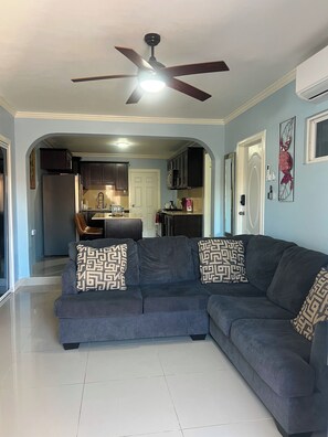 Living area - Spacious 6-bedroom villa at Hellshire w/ private pool, games room & gym (Portmore)