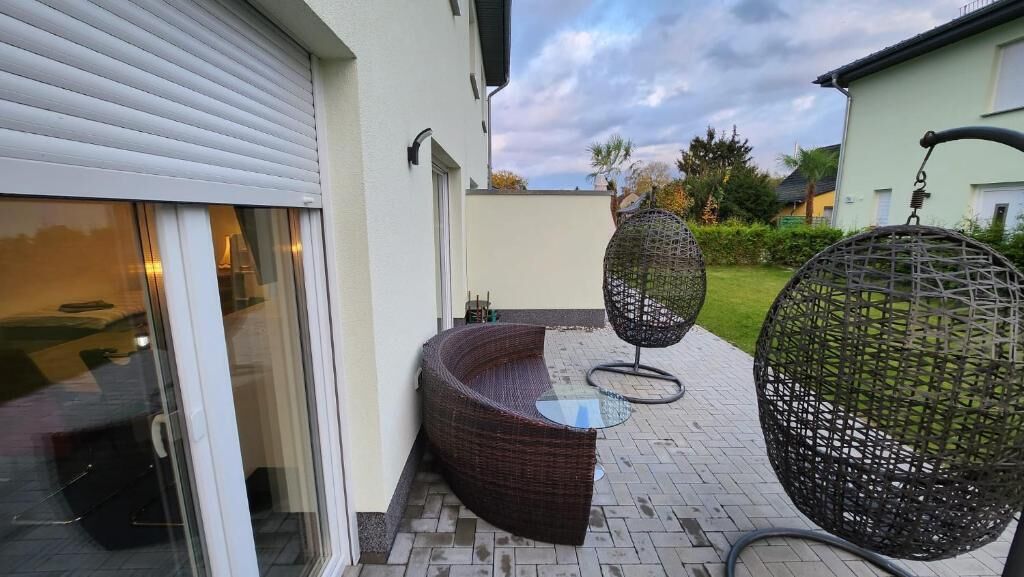 Familie vierpersoonskamer, uitzicht op tuin | Terras