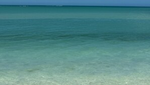 A clear view of the ocean with a distant horizon.