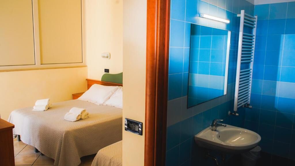 Classic Quadruple Room, Balcony | In-room safe, free WiFi