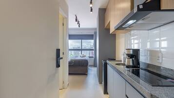 Comfort Apartment, Kitchen, City View | Private kitchen | Full-size fridge, microwave, cookware/dishes/utensils