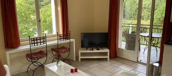 A sunny living room with a loggia and a beautiful view of Mont Ventoux