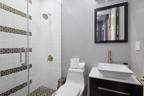 Shower, hair dryer, towels, shampoo