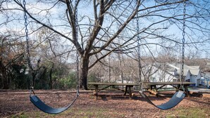 A park with a swing set and a picnic table. - Ridge Retreats Duo: Big Groups/Free Parking/Wifi (Birmingham)