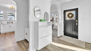 A modern kitchen with white cabinetry and a built-in oven. - Comfortable SFH for Families & Groups • Easy Walk to Local Shops and Eateries (Downers Grove)
