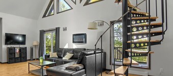 Enjoy our cozy waterfront chalet with a private hot tub, stunning views,