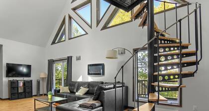 Enjoy our cozy waterfront chalet with a private hot tub, stunning views,