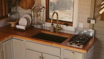 Fridge, stovetop, cookware/dishes/utensils, dining tables