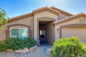 Exterior - Spacious desert home with hot tub, covered patio, grill, & modern finishes (Surprise)