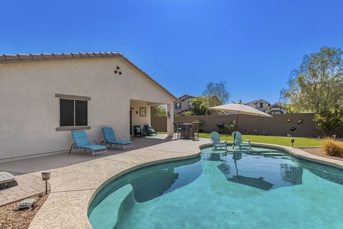 Airy desert home with an enclosed yard, private pool, hot tub, firepit, & W/D