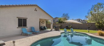 Airy desert home with an enclosed yard, private pool, hot tub, firepit, & W/D
