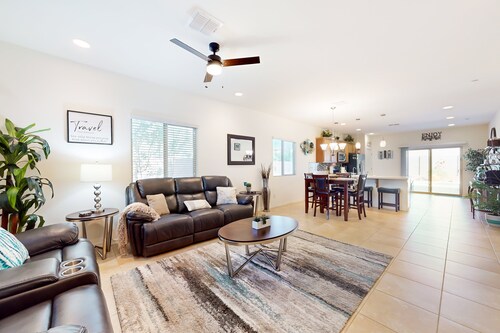 Airy desert home with an enclosed yard, private pool, hot tub, firepit, & W/D