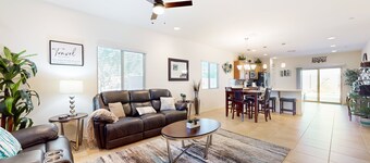 Airy desert home with an enclosed yard, private pool, hot tub, firepit, & W/D