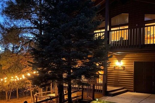 Serene, two-story cabin with a game room, washer/dryer, & furnished deck