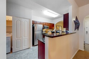 Fridge, microwave, oven, stovetop - Dog-friendly mountain view condo with pool, gym, grill, fireplace, & sunroom (Tucson)