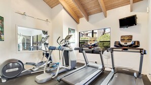 A gym with treadmills, elliptical machines, and a stationary bike. - Radiant retreat with pool and hot tub access, sunroom, washer/dryer, gym, & AC (Tucson)