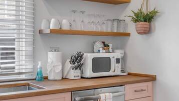 Fridge, stovetop, dishwasher, coffee/tea maker