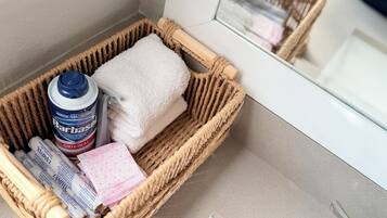 Hair dryer, towels, soap, toilet paper