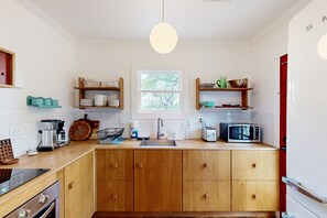 Fridge, microwave, oven, stovetop - Historic Pueblo Home w/ yard and patio, modern kitchen - Sam Hughes neighborhood (Tucson)
