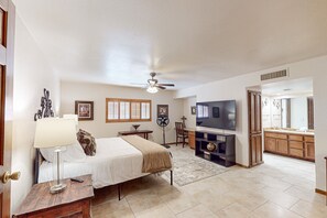 A bedroom with a bed, bedside table, lamp, and a ceiling fan. - 4 BR house with pool, putting green, great patio (Scottsdale)