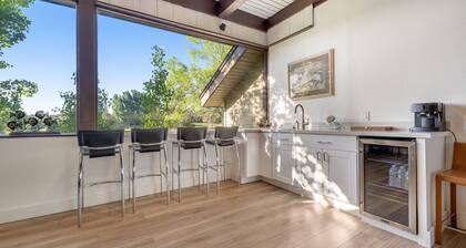 Refined home with a game room, balcony, grill, washer/dryer, & four bedrooms