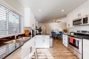 Fridge, microwave, oven, stovetop - Updated home with enclosed yard, pool, grill, full kitchen, games, W/D, & AC (Mesa)