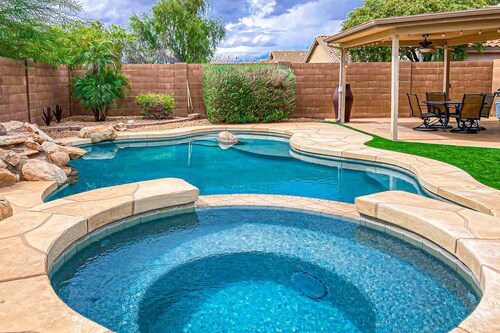 Desert charmer with enclosed yard, heated pool, smart TVs, W/D, & full kitchen