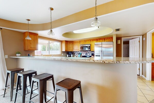 Fridge, microwave, oven, stovetop - Single-level vacation home with fenced yard, furnished patio, & washer/dryer (Tempe)