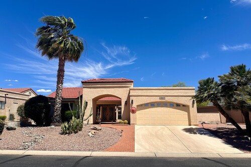 Mountain-view home with shaded patio, large yard, on-site golf & tennis