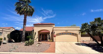 Mountain-view home with shaded patio, large yard, on-site golf & tennis