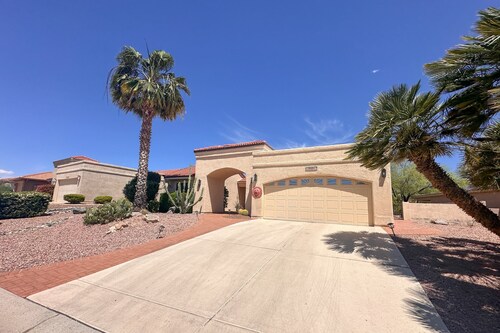 Mountain-view home with shaded patio, large yard, on-site golf & tennis