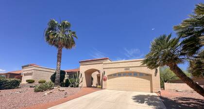 Mountain-view home with shaded patio, large yard, on-site golf & tennis