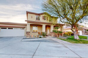 Exterior - Spacious escape with enclosed yard, outdoor living, pool table, & fireplace (Indio)