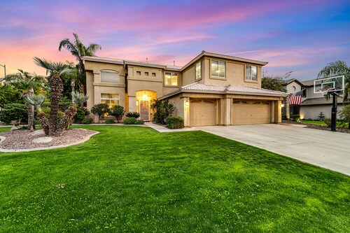 Exquisite home with firepit, game room, heated pool, pool spa, & putting green