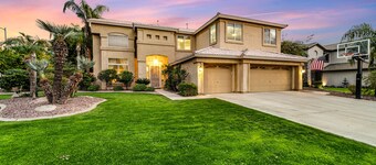 Exquisite home with firepit, game room, heated pool, pool spa, & putting green