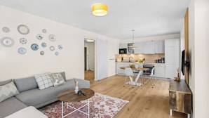 A modern apartment with a living room, kitchen, and dining area. - The View B04 Briese - Garden furniture, elevator, shared Sauna, parking space (Dagebüll)