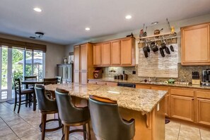 Fridge, microwave, oven, stovetop - Classic, dog-friendly home near golf with heated pool, enclosed yard & fireplace (Indio)