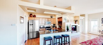 Serene mountain view condo with balcony, patio, washer/dryer, & board games