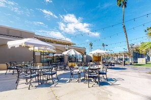 Outdoor dining - Ground-floor, golf-adjacent getaway w/ free WiFi, central A/C, & 20 shared pools (Palm Desert)
