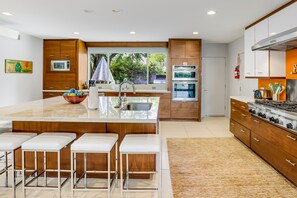 Fridge, microwave, oven, stovetop - Stunning, dog-friendly home with central AC, W/D, and private pool & pool spa (Palm Springs)
