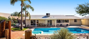 Dog-friendly sunshine stay with private pool, spacious yard, central AC & W/D