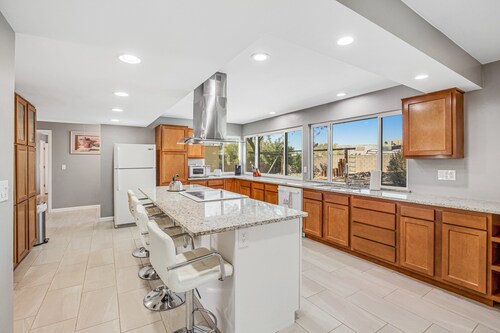 Dog-friendly sunshine stay with private pool, spacious yard, central AC & W/D